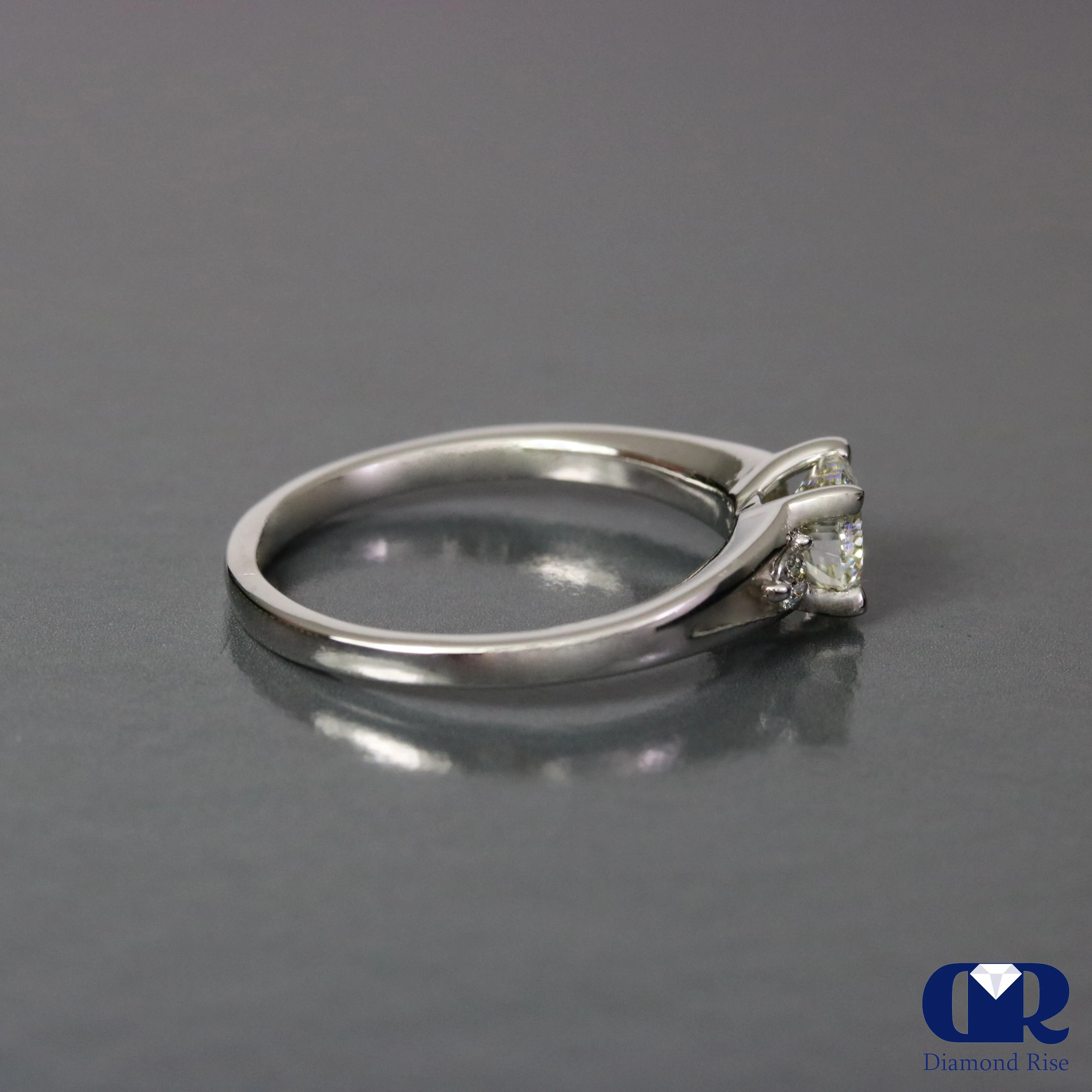 0.67 Ct Round Cut Diamond There Stone Engagement Ring In 14K Gold