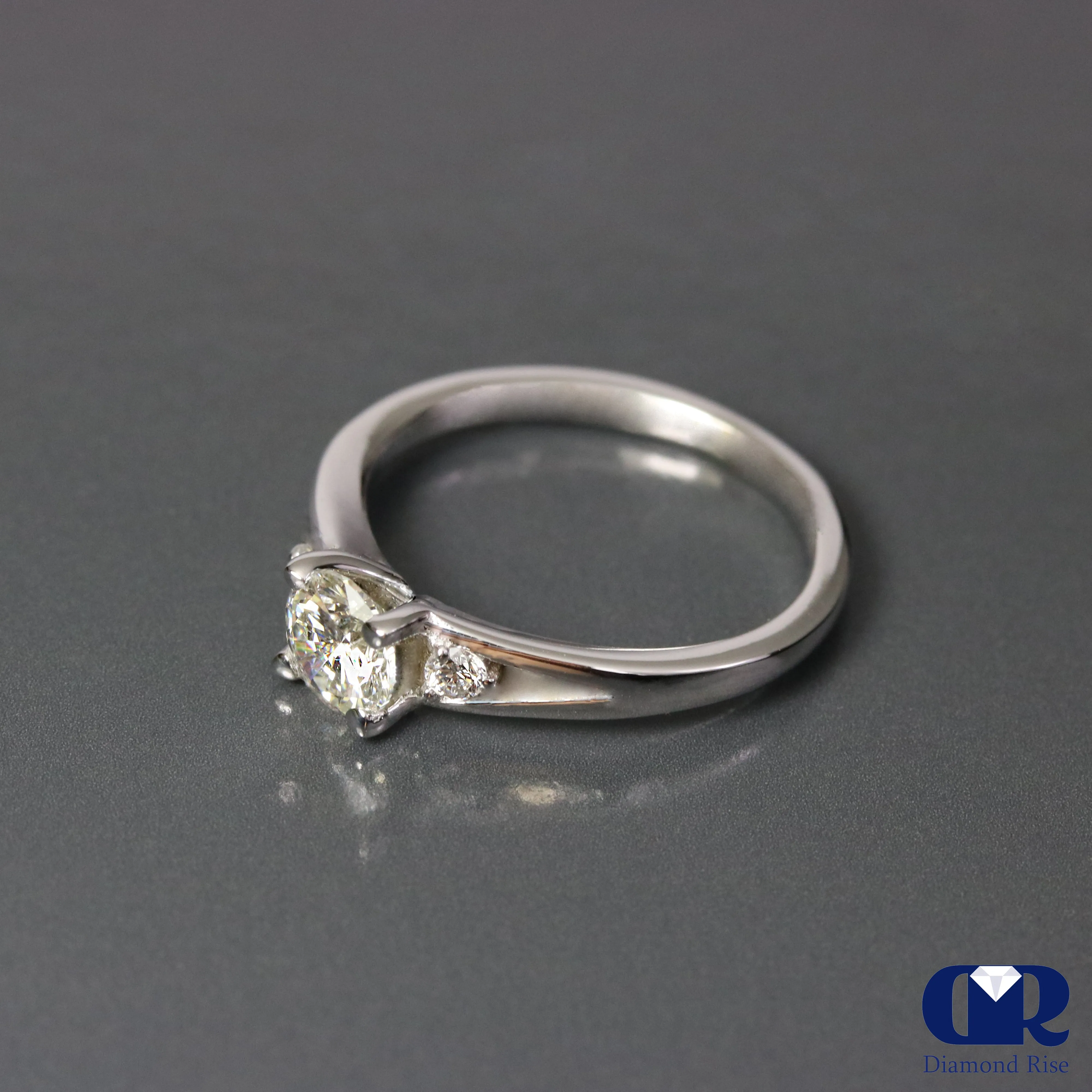 0.67 Ct Round Cut Diamond There Stone Engagement Ring In 14K Gold