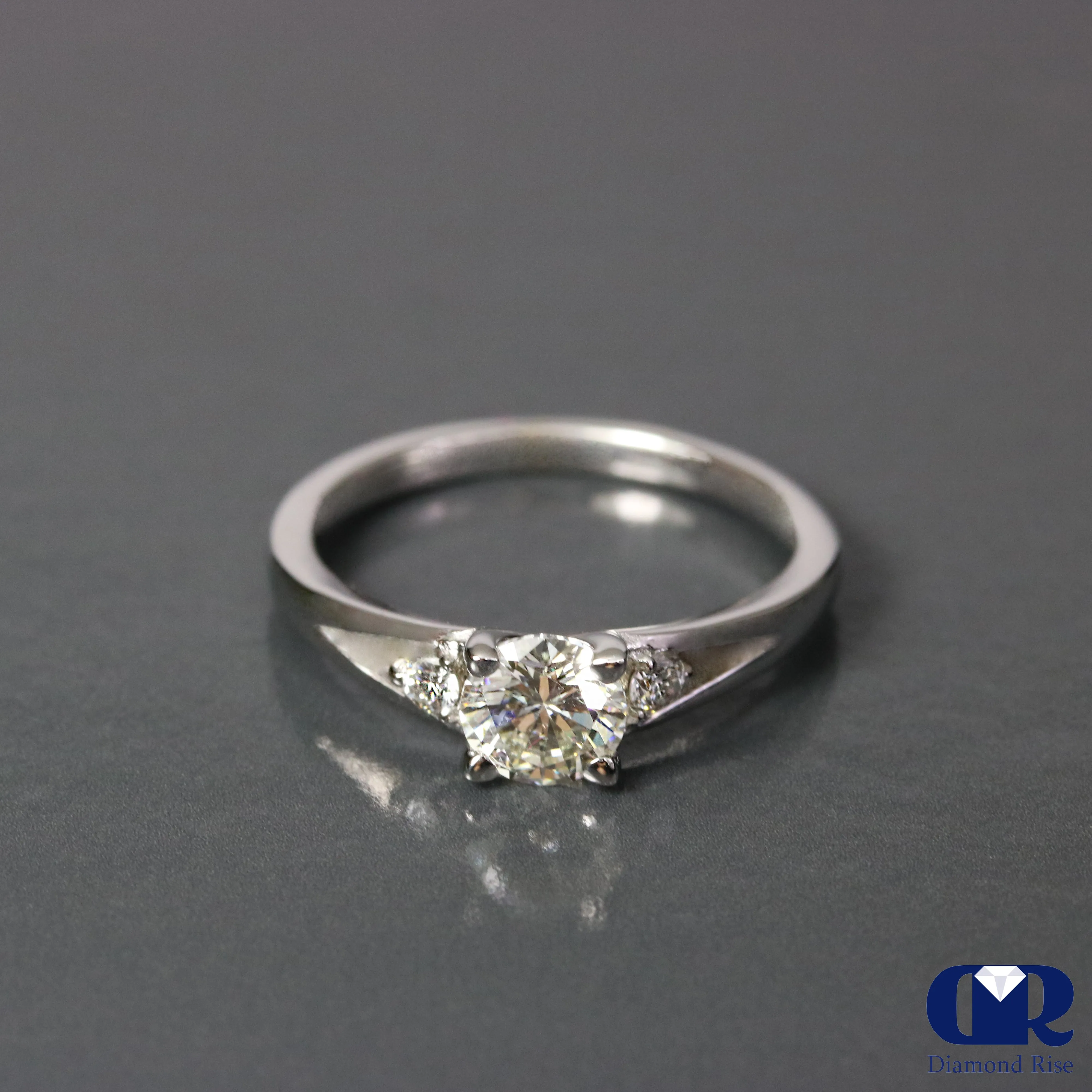 0.67 Ct Round Cut Diamond There Stone Engagement Ring In 14K Gold
